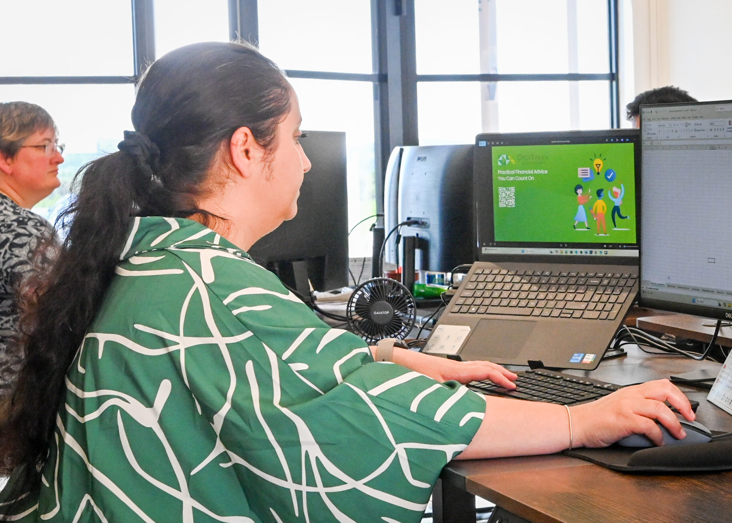 a woman is working in computer